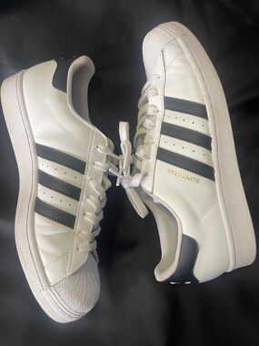 adidas men’s size 11 White Sneakers with Black Stripes and Gold Accent